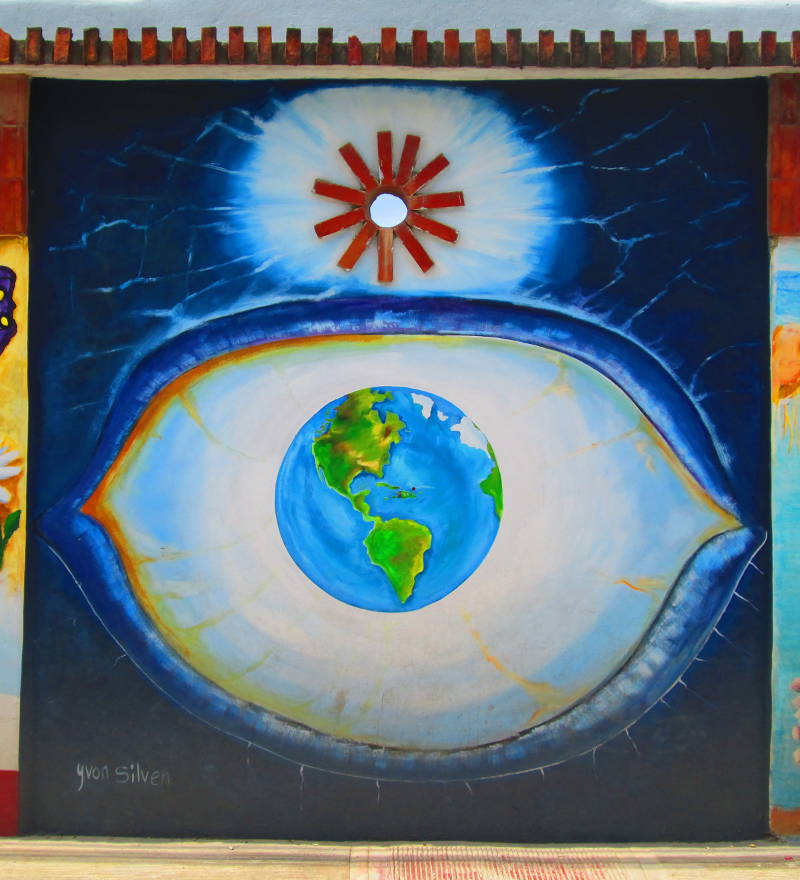 An eye with a globe of the world as its iris